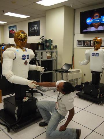 Jerryll CEO of We Buy Houses In Connecticut shakes robonauts hand